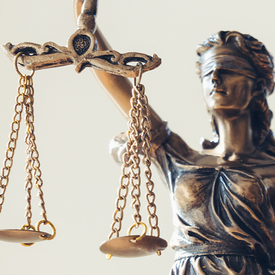 Statue of Lady Justice holding scales with 